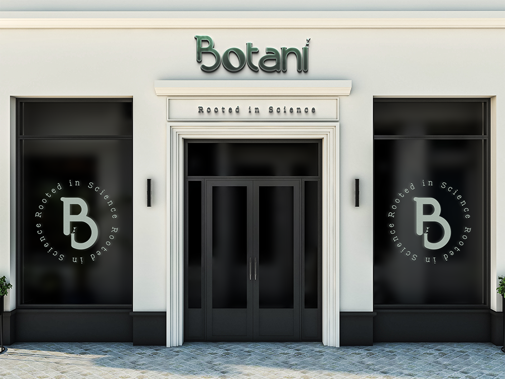A storefront with large dark windows featuring the name "Botani" and the slogan "Rooted in Science" displayed above the entrance. Circular logos with the letter "B" are on the windows. The building facade is light in color with a clean, modern design.