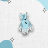 A sticker collection features a stylized mermaid hand figure, making the peace sign; on a light, textured background adorned with soft blue shapes and small star icons.