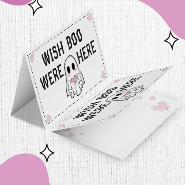 The Wish Boo Were Here Valentines Card features a charming ghost illustration holding a pink heart, with the text "Wish Boo Were Here". It's set against a white and pink background adorned with abstract shapes and small star accents, with pink hearts scattered around for added sweetness.